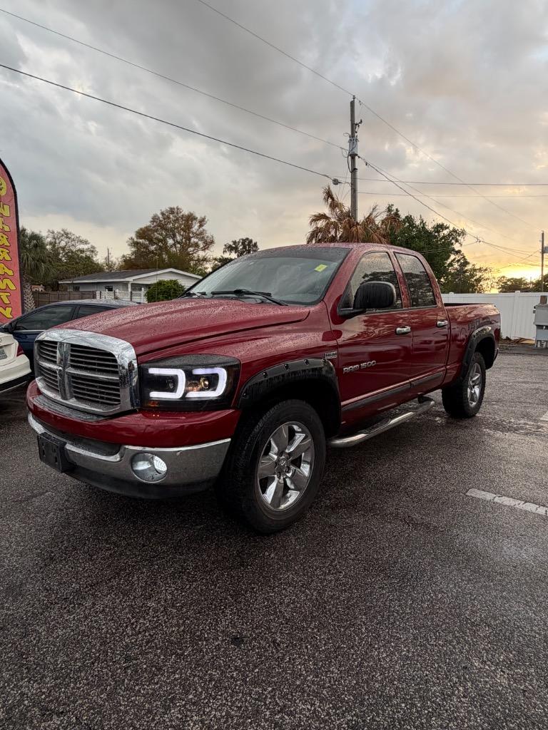 Red 2006 Dodge RAM 1500 Laramie Quad Cab 4WD Pickup Truck Four-Wheel Drive