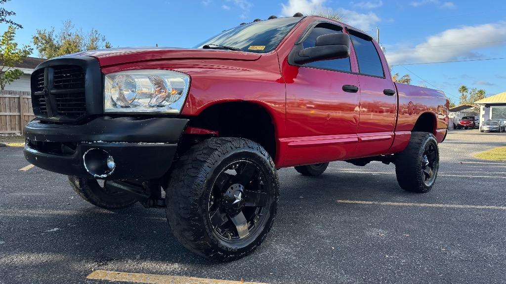 Red 2006 Dodge RAM 1500 Laramie Quad Cab 4WD Pickup Truck Four-Wheel Drive